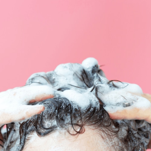 Guide on how often to wash different hair types for optimal health and shine.