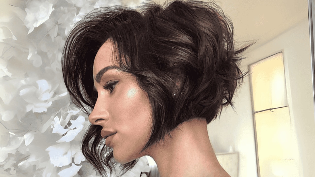 Curly pixie cut with a fringe
