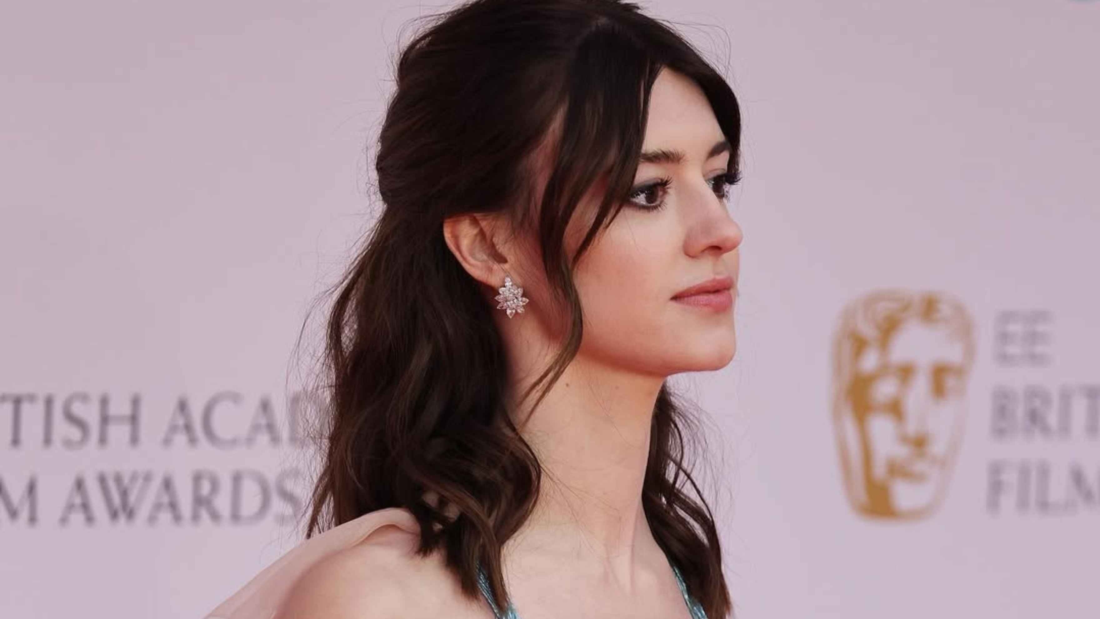 Textured Mid-Length Cut with Layers and Curtain Bangs