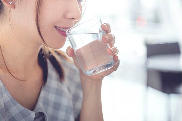 woman drinking water woman drinking water